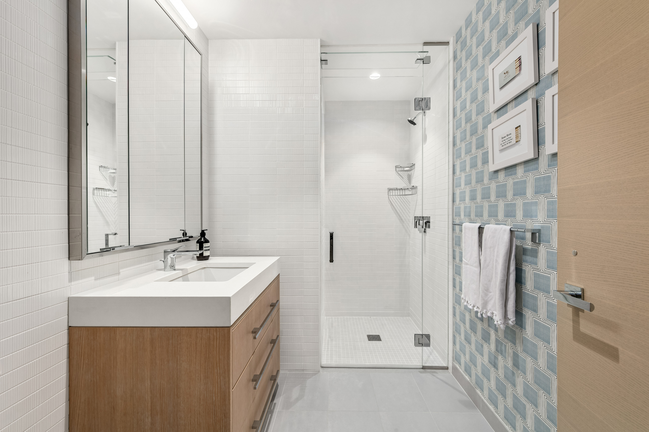 212 West 95th Street, Unit 4B Manhattan, NY 10025 - Photo 8 of 13 a bathroom with a sink double vanity and shower