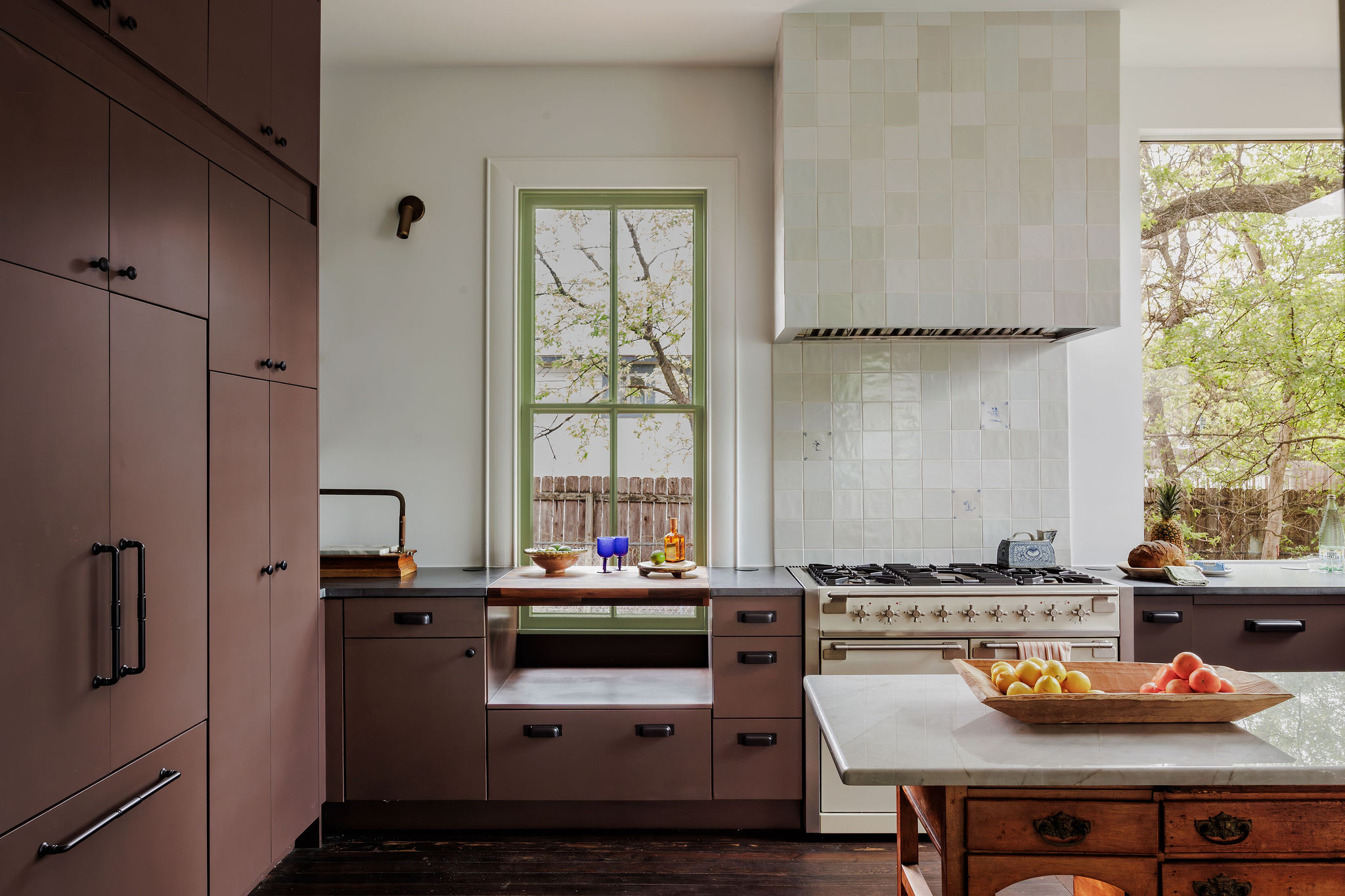 606 West 35th Street Austin, TX 78705 - Photo 14 of 37 a kitchen with stainless steel appliances granite countertop a sink stove and refrigerator