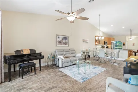 a living room with furniture and a piano