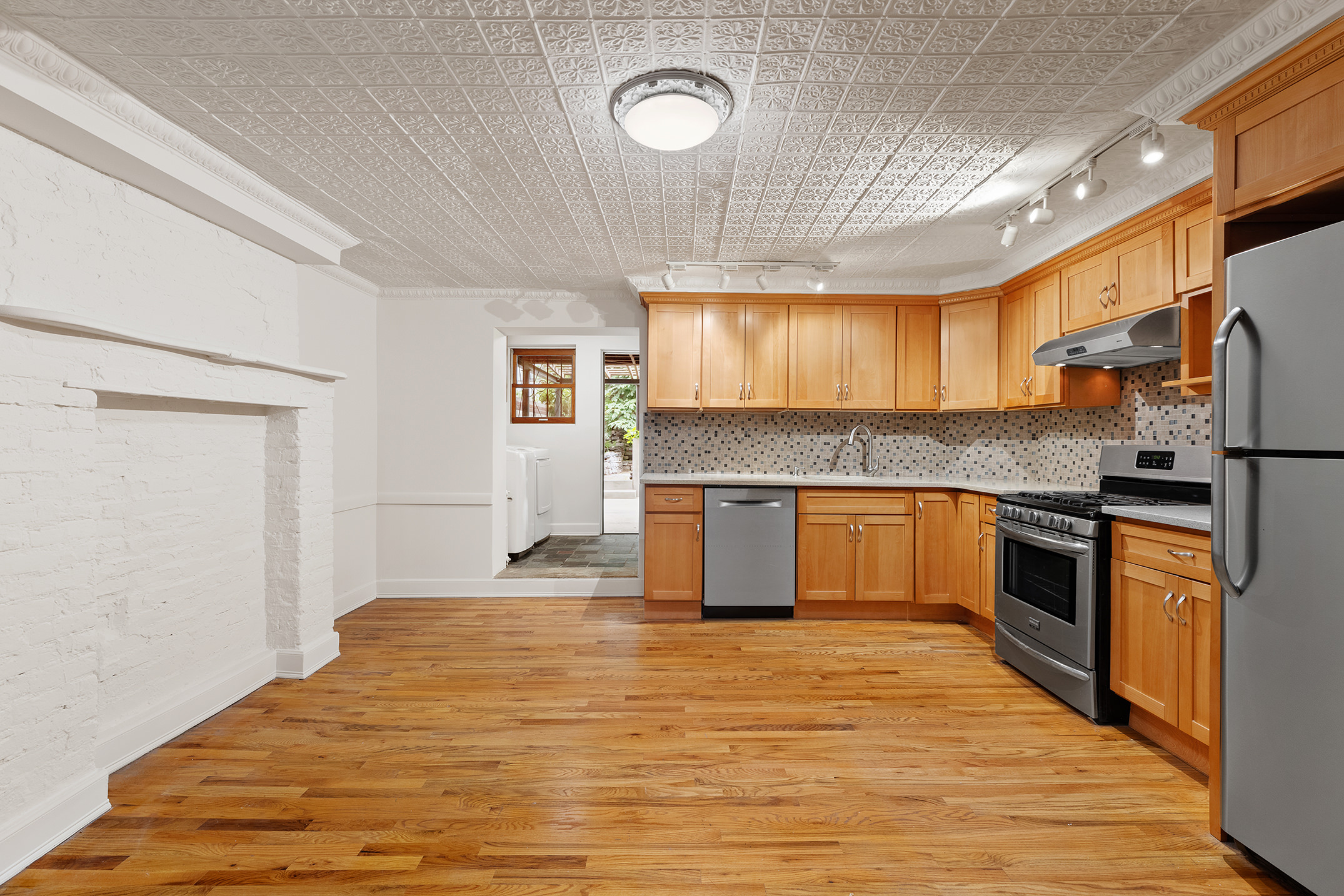 115 A 2nd Place Brooklyn, NY 11231 - Photo 19 of 27 a large kitchen with stainless steel appliances granite countertop a granite counter tops and a window