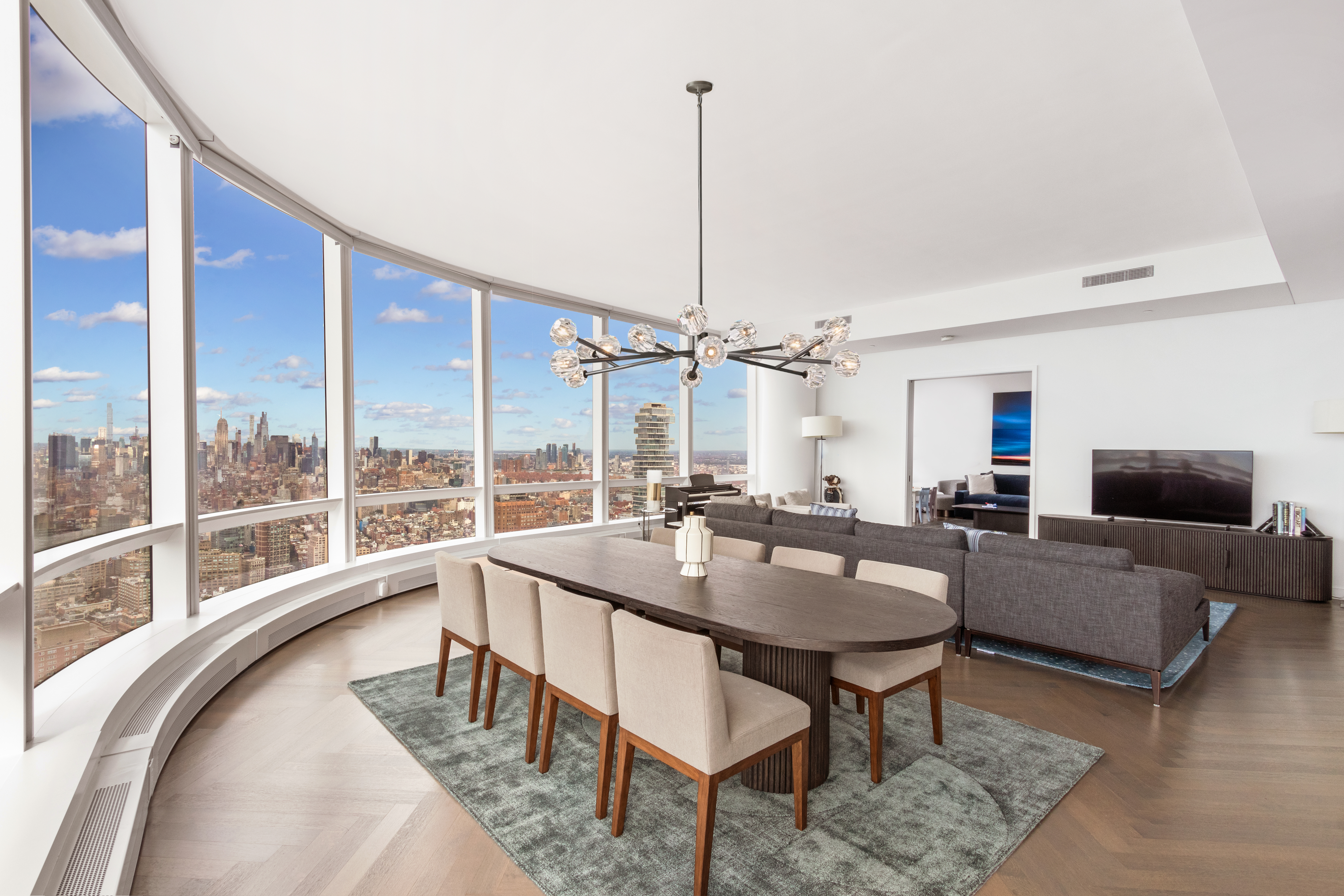 111 Murray Street, Unit 61W Manhattan, NY 10007 - Photo 25 of 35 a living room with furniture and a chandelier