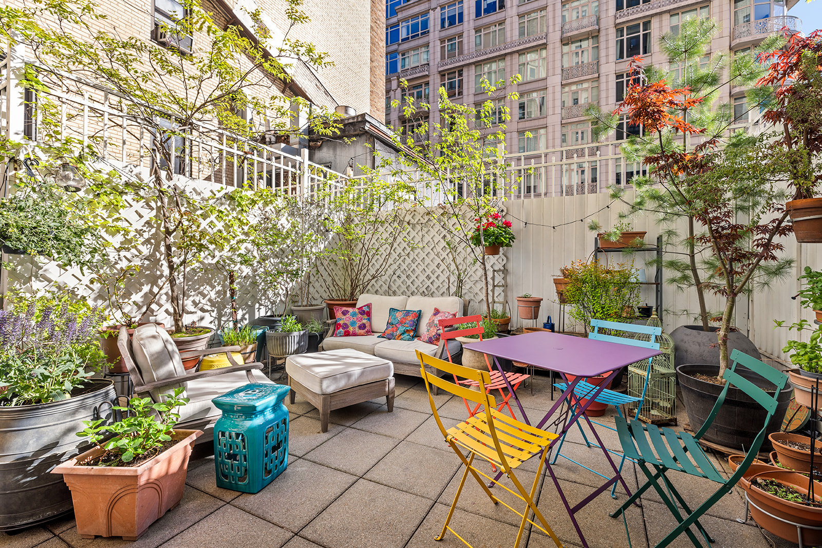 a table and chairs in front of a building