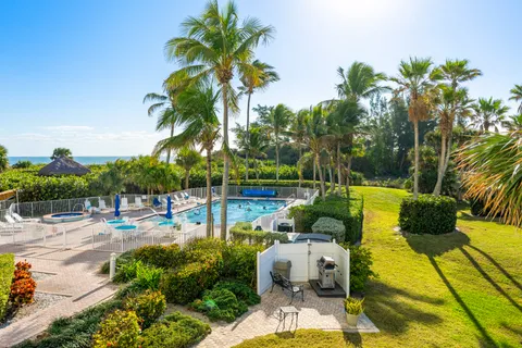 a view of a swimming pool with lounge chairs