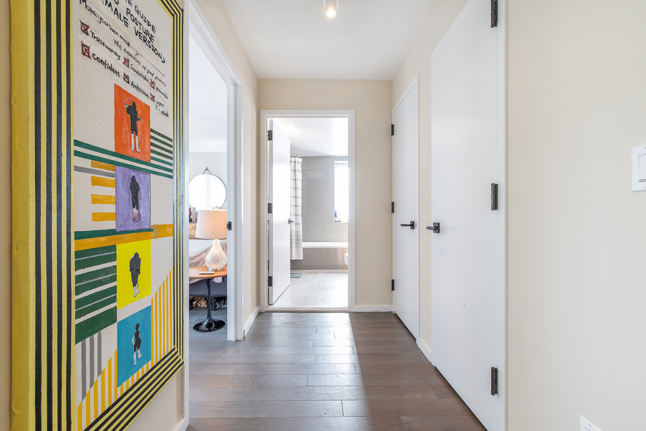 385 1st Avenue, Unit 6G Manhattan, NY 10010 - Photo 9 of 19 a view of a hallway with wooden floor and a bathroom