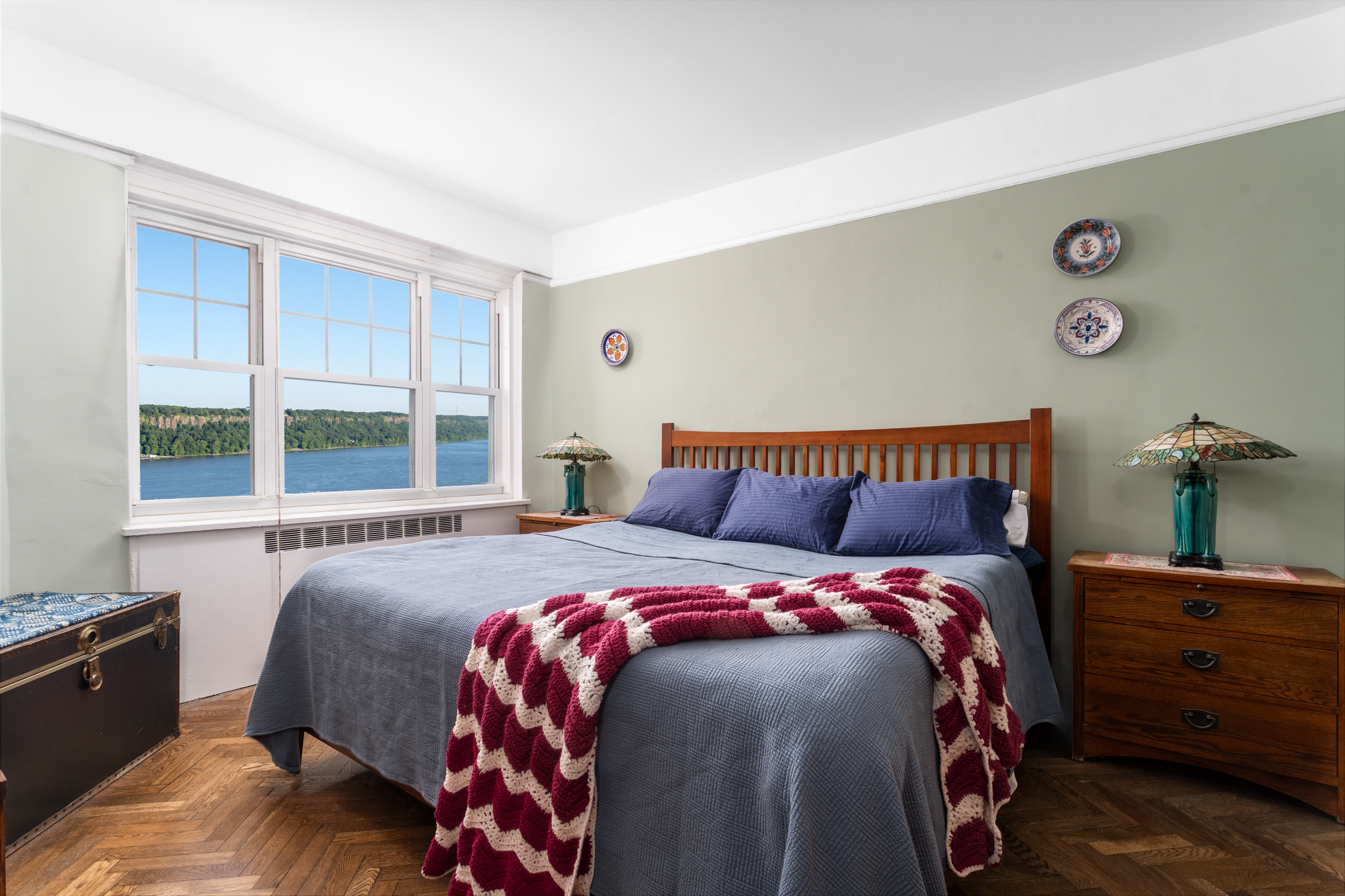180 Cabrini Boulevard, Unit 61 Manhattan, NY 10033 - Photo 11 of 33 a bedroom with a bed and a window with chair