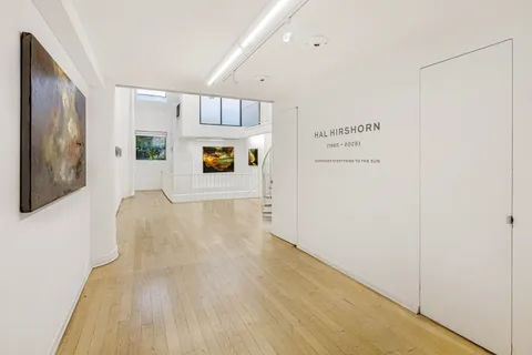 a view of a hallway with white walls
