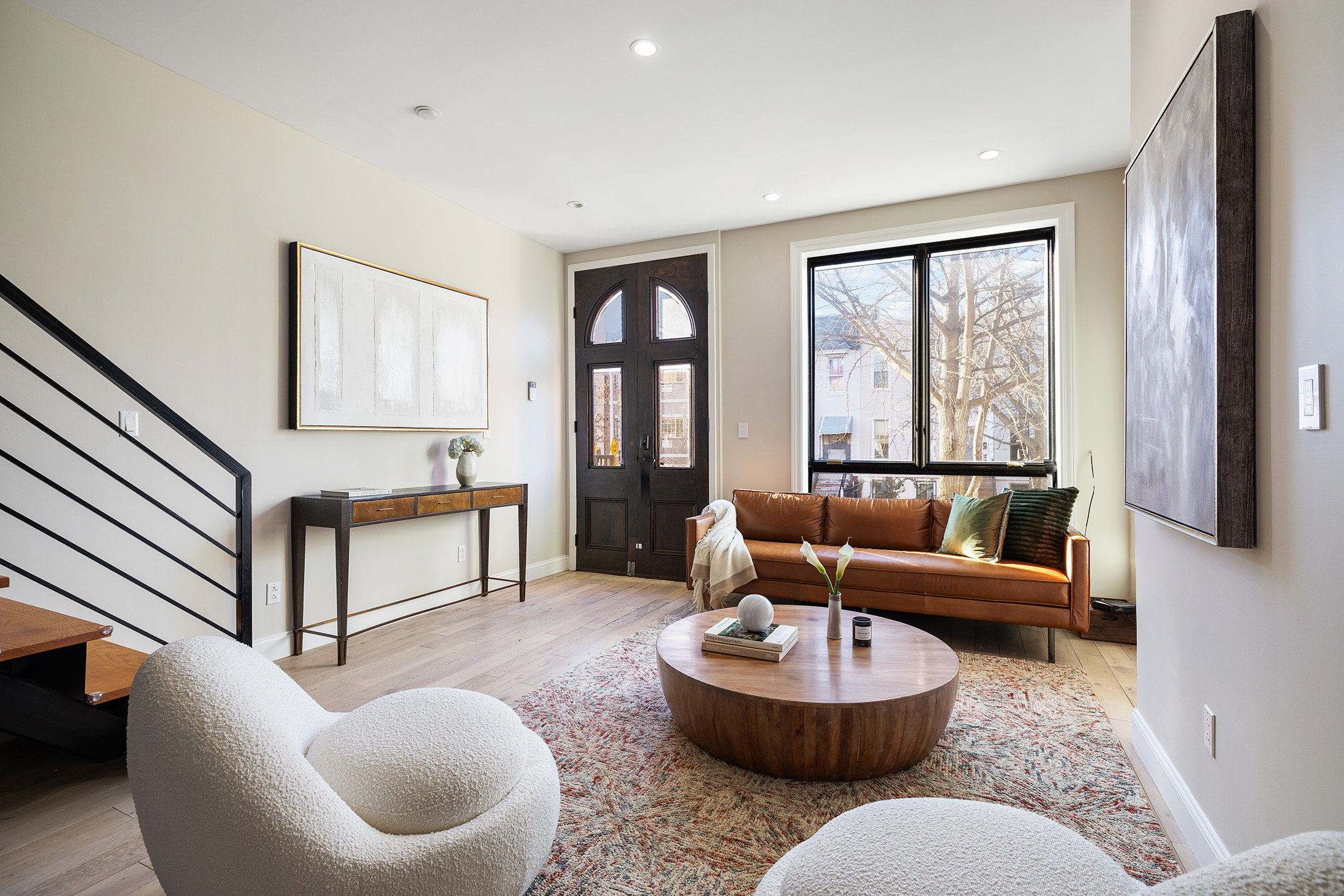 34 Woodbine Street Brooklyn, NY 11221 - Photo 4 of 15 a living room with furniture and a large window