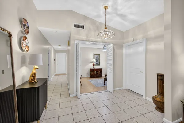 a view of a hallway view with staircase