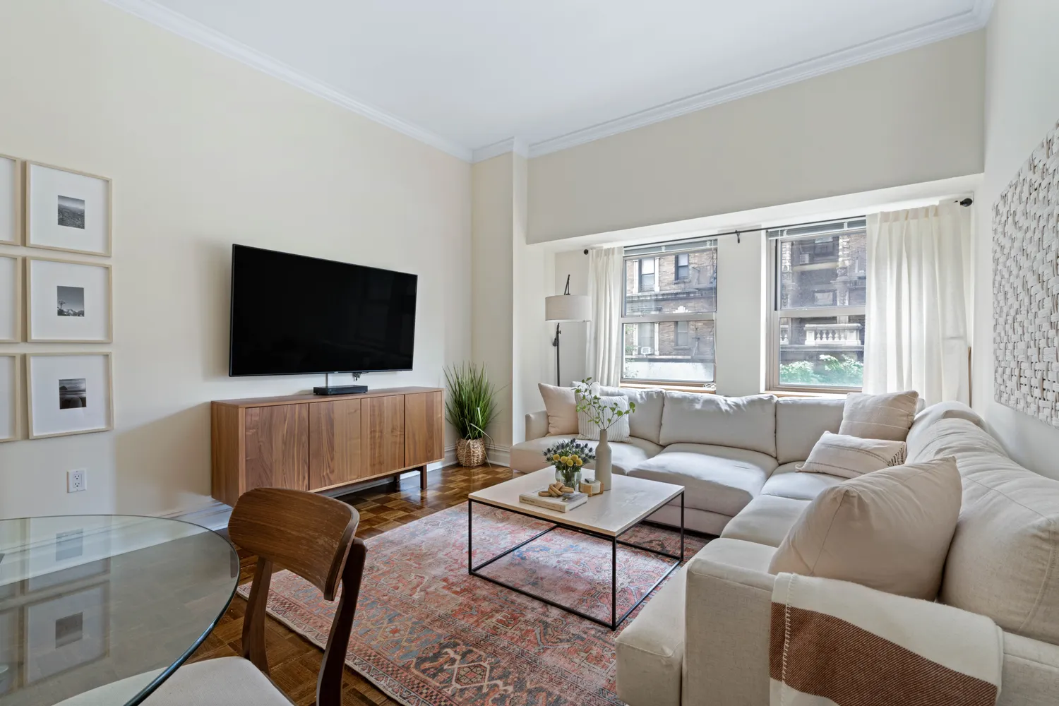 a living room with furniture and a flat screen tv