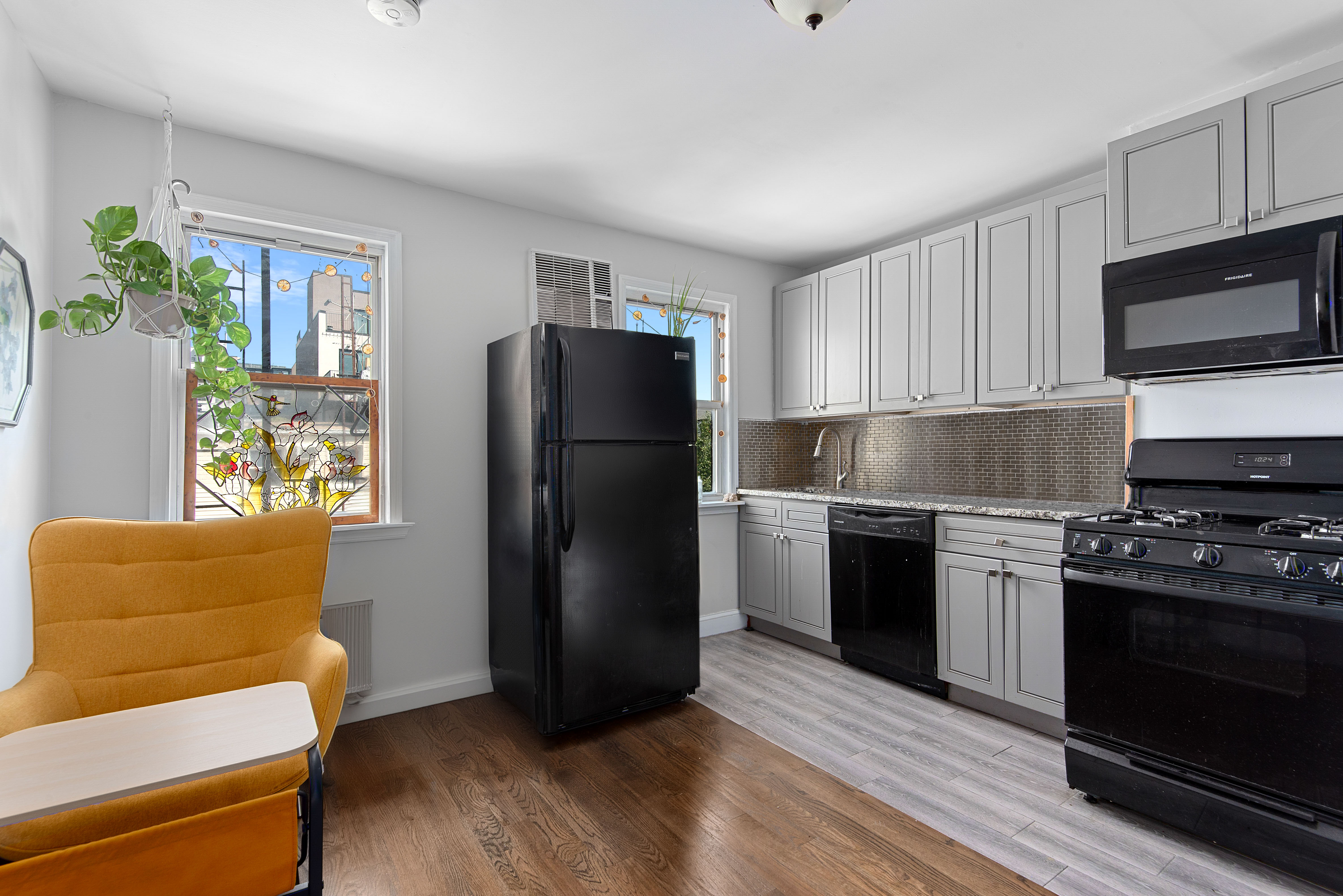 269 Ainslie Street, Unit 2 Brooklyn, NY 11211 - Photo 2 of 11 a kitchen with a refrigerator stove and microwave