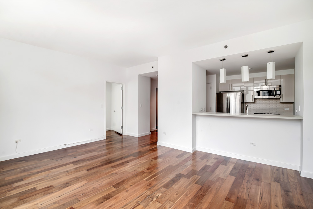 125 North 5th Street, Unit 3D Brooklyn, NY 11249 - Photo 1 of 10 a view of kitchen with cabinets and wooden floor