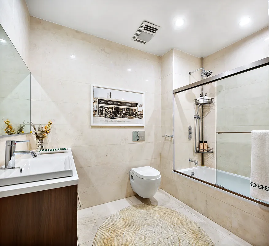 351 Prospect Place, Unit 1A Brooklyn, NY 11238 - Photo 5 of 7 a bathroom with a sink toilet and shower