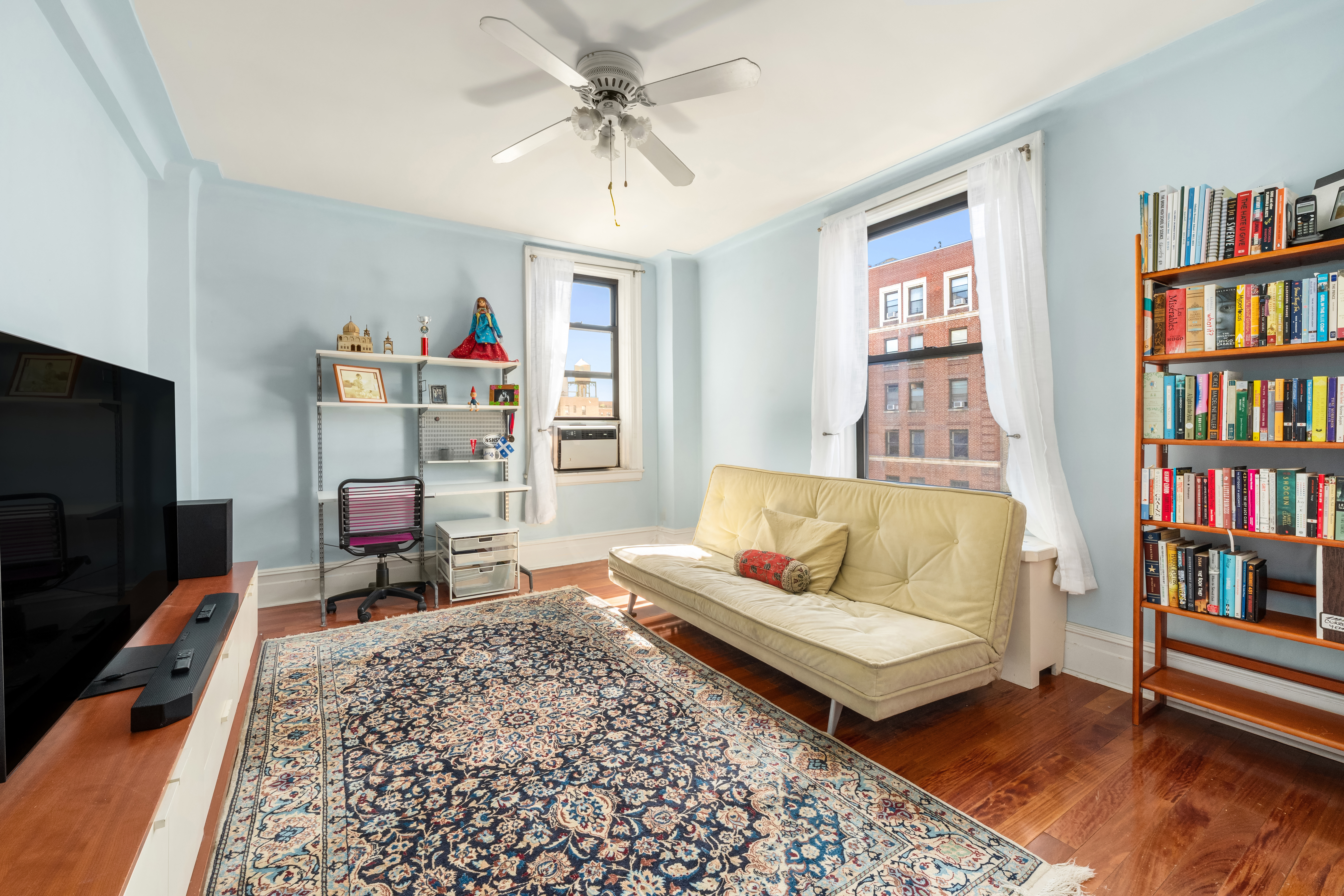 514 West End Avenue, Unit 12BC Manhattan, NY 10024 - Photo 5 of 15 a living room with furniture and a flat screen tv