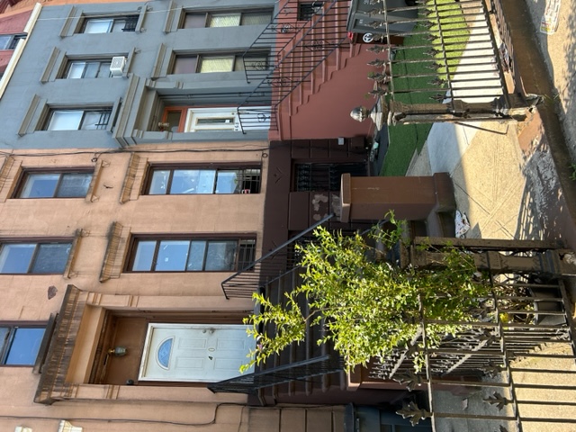470 Jefferson Avenue Brooklyn, NY 11221 - Photo 2 of 2 a front view of a house with a garden