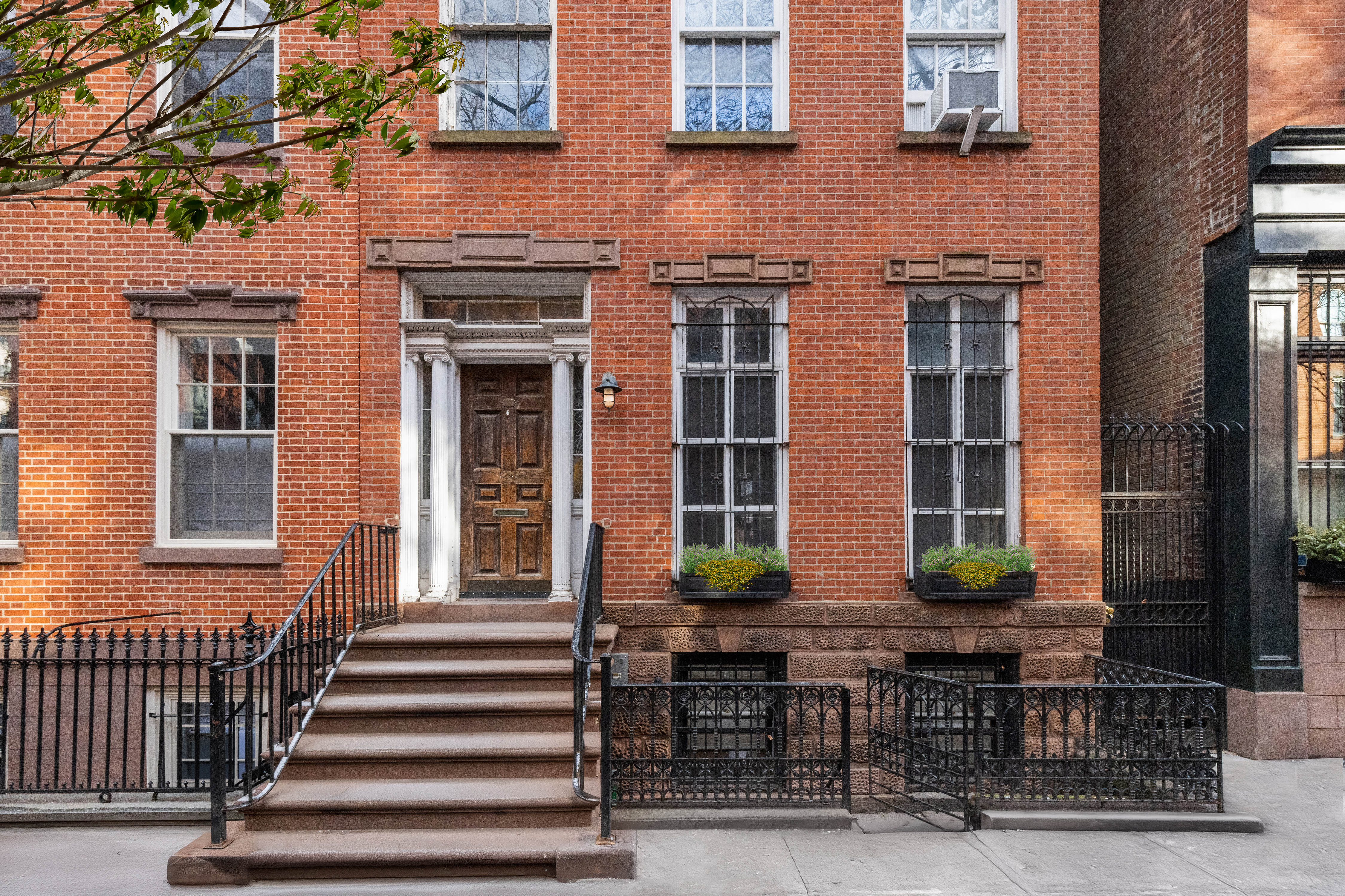 262 West 11th Street Manhattan, NY 10014 - Photo 7 of 27 a front view of a building with glass windows