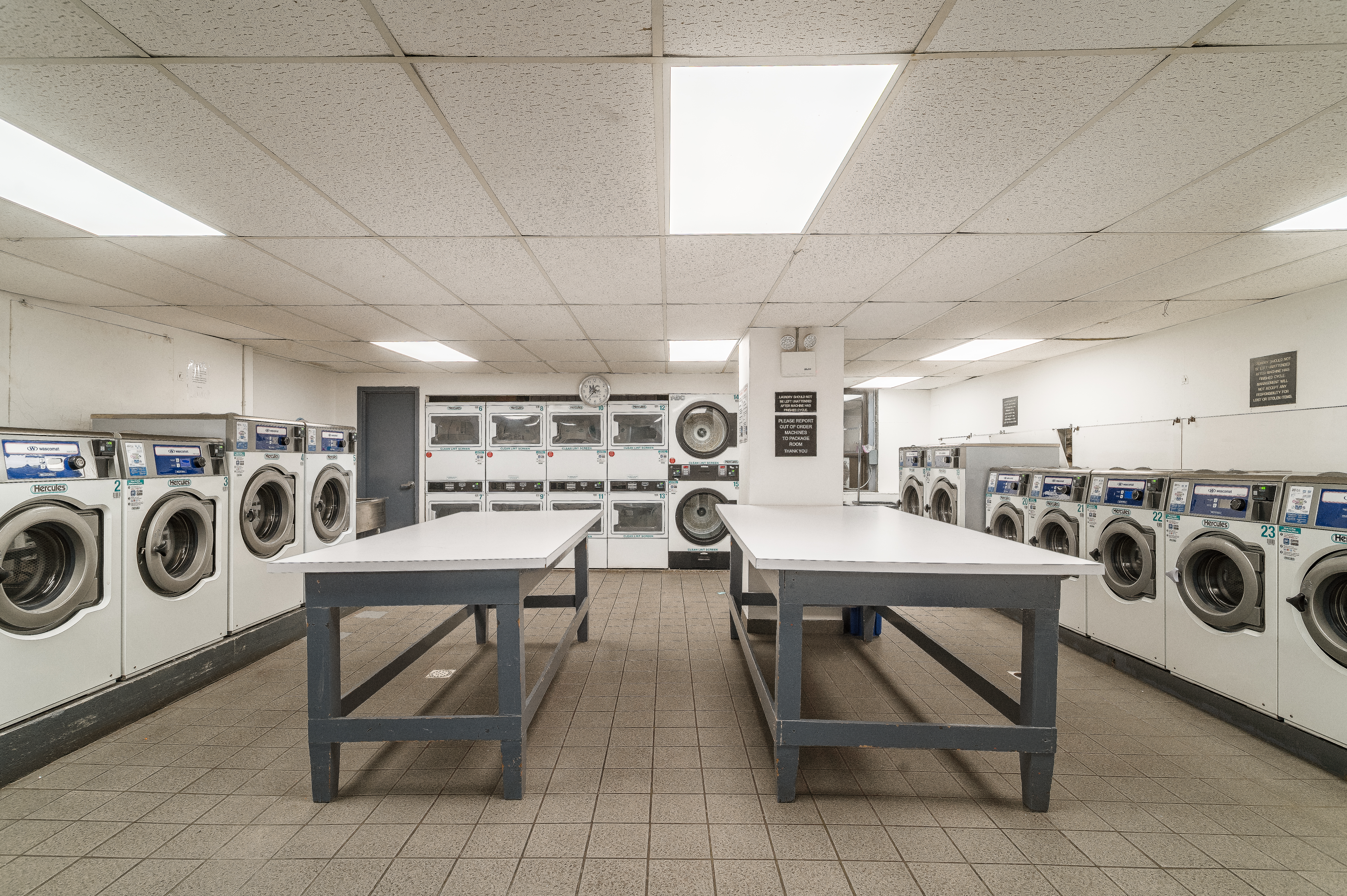 180 East 79th Street, Unit 5A Manhattan, NY 10075 - Photo 16 of 19 a view of a room with washer and dryer