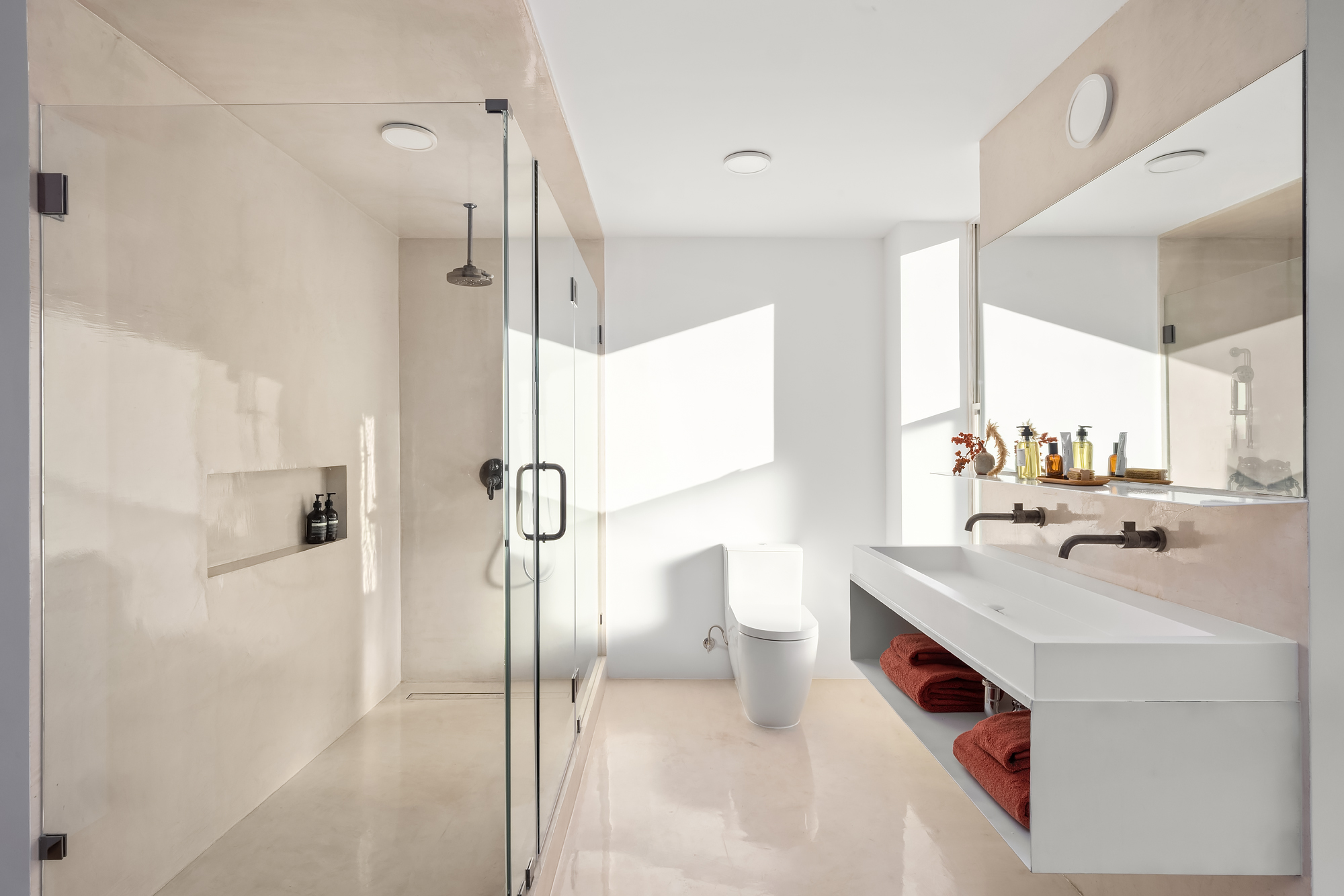 61 South 4th Street Brooklyn, NY 11249 - Photo 17 of 29 a bathroom with a sink mirror and a shower