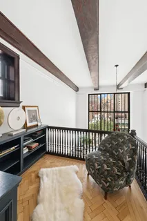 a bed room with furniture and a window