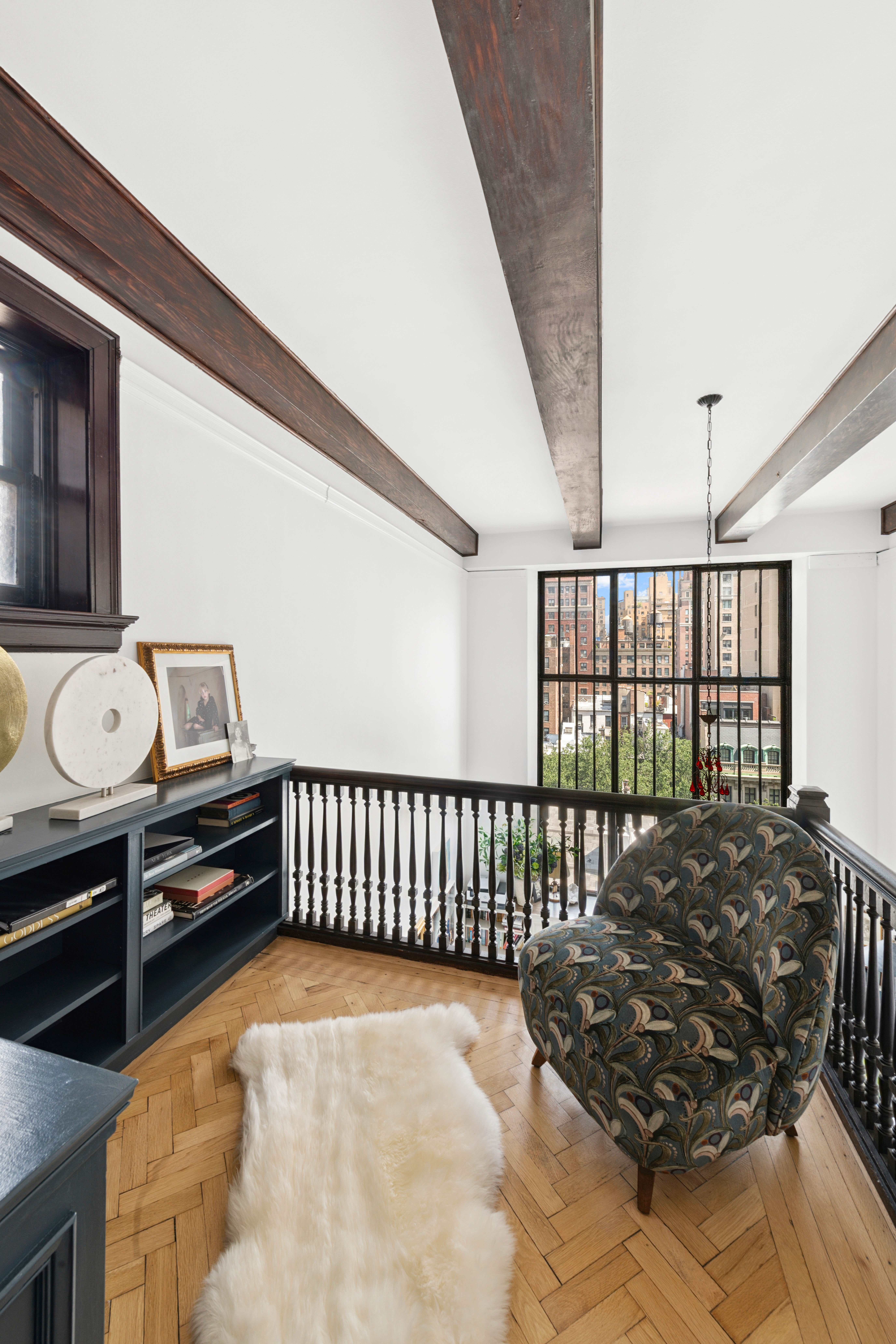 1 West 67th Street, Unit 608 Manhattan, NY 10023 - Photo 7 of 16 a bed room with furniture and a window