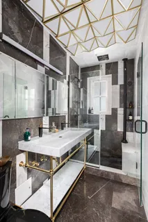 a kitchen with a table chairs sink and cabinets