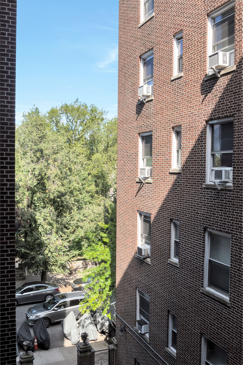 720 West 173rd Street, Unit 38 Manhattan, NY 10032 - Photo 8 of 9 a aerial view of a house with a yard