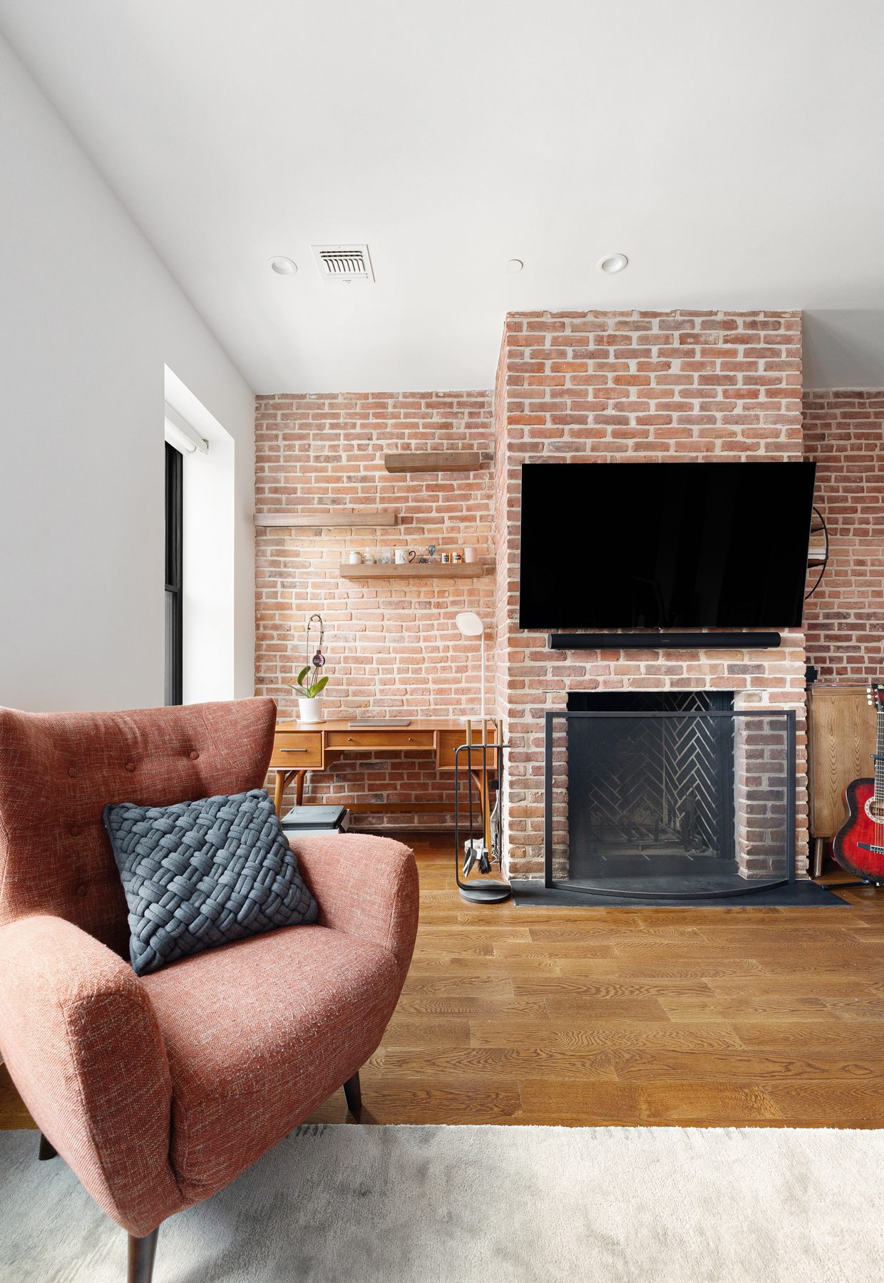 110 Summit Street, Unit 2 Brooklyn, NY 11231 - Photo 2 of 13 a living room with furniture a fireplace and a flat screen tv