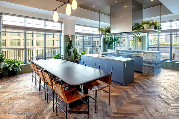 a view of a dining room with furniture window and wooden floor