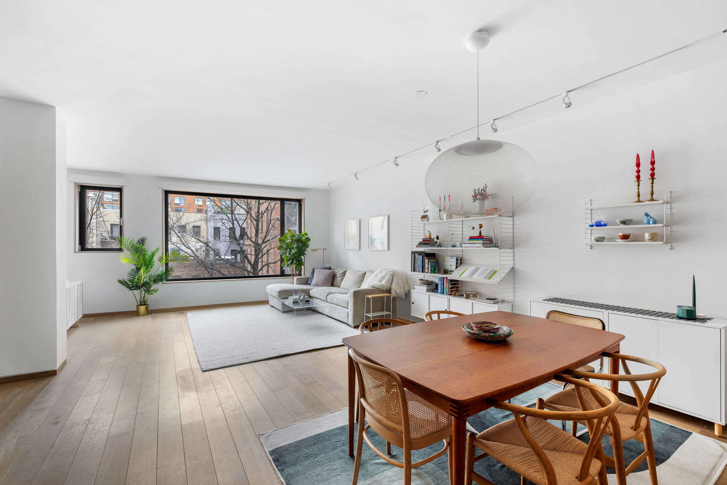 210 Pacific Street, Unit 3E Brooklyn, NY 11201 - Photo 2 of 14 a view of a dining room with furniture window and wooden floor