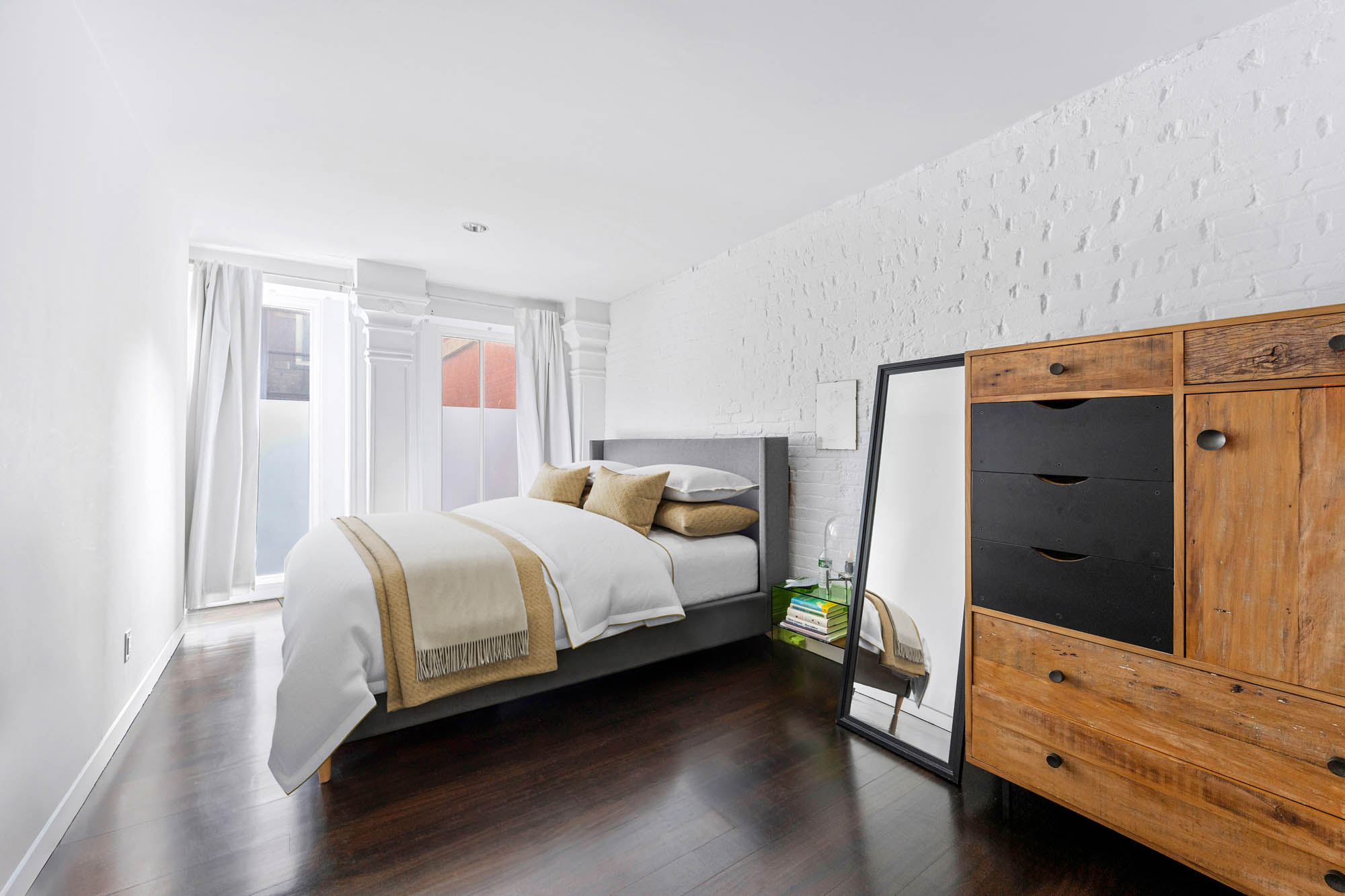 8 Thomas Street, Unit 2 Manhattan, NY 10007 - Photo 5 of 9 a bedroom with a bed and a dresser