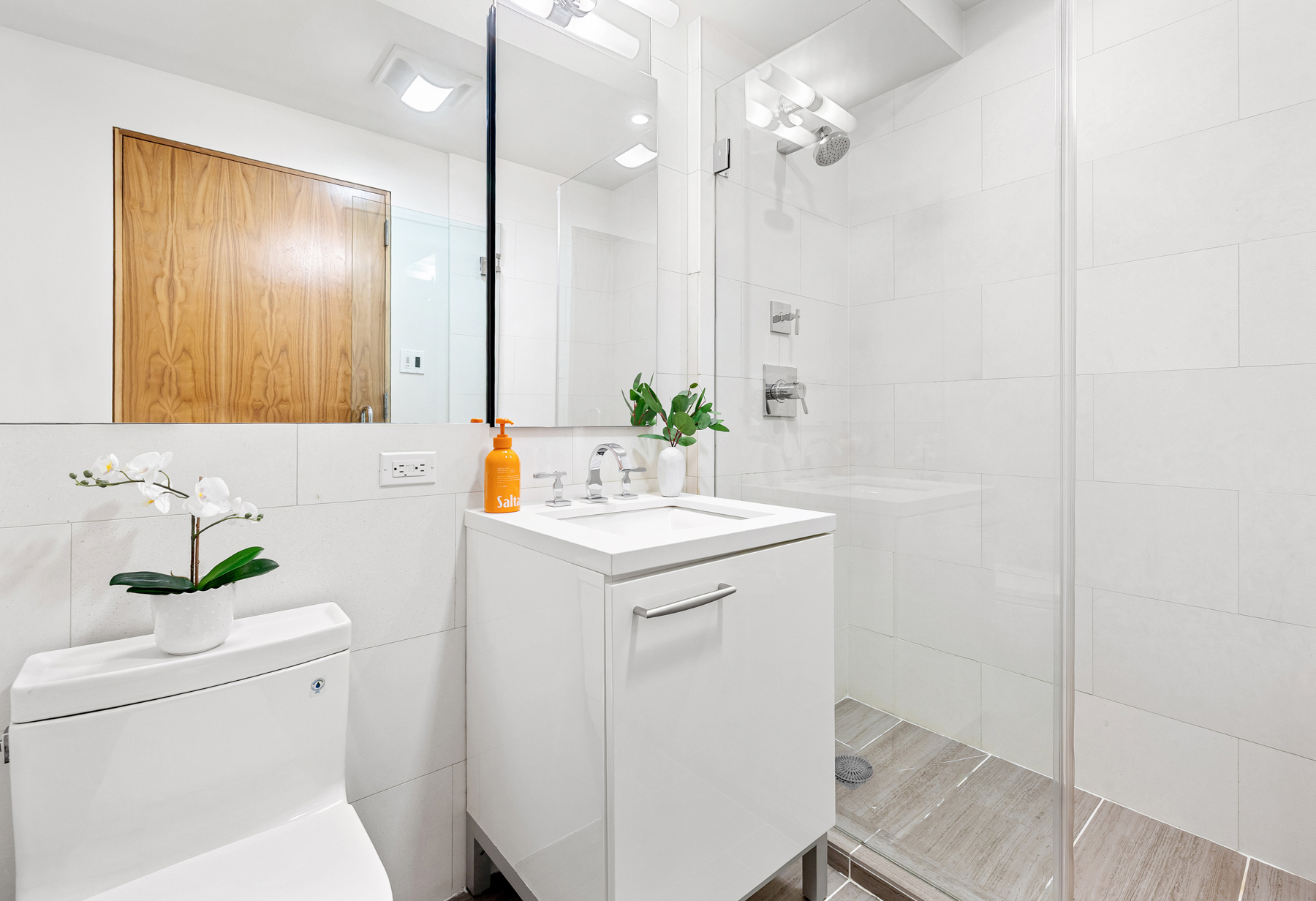 151 West 21st Street, Unit 10A Manhattan, NY 10011 - Photo 23 of 26 a bathroom with a sink a toilet and shower