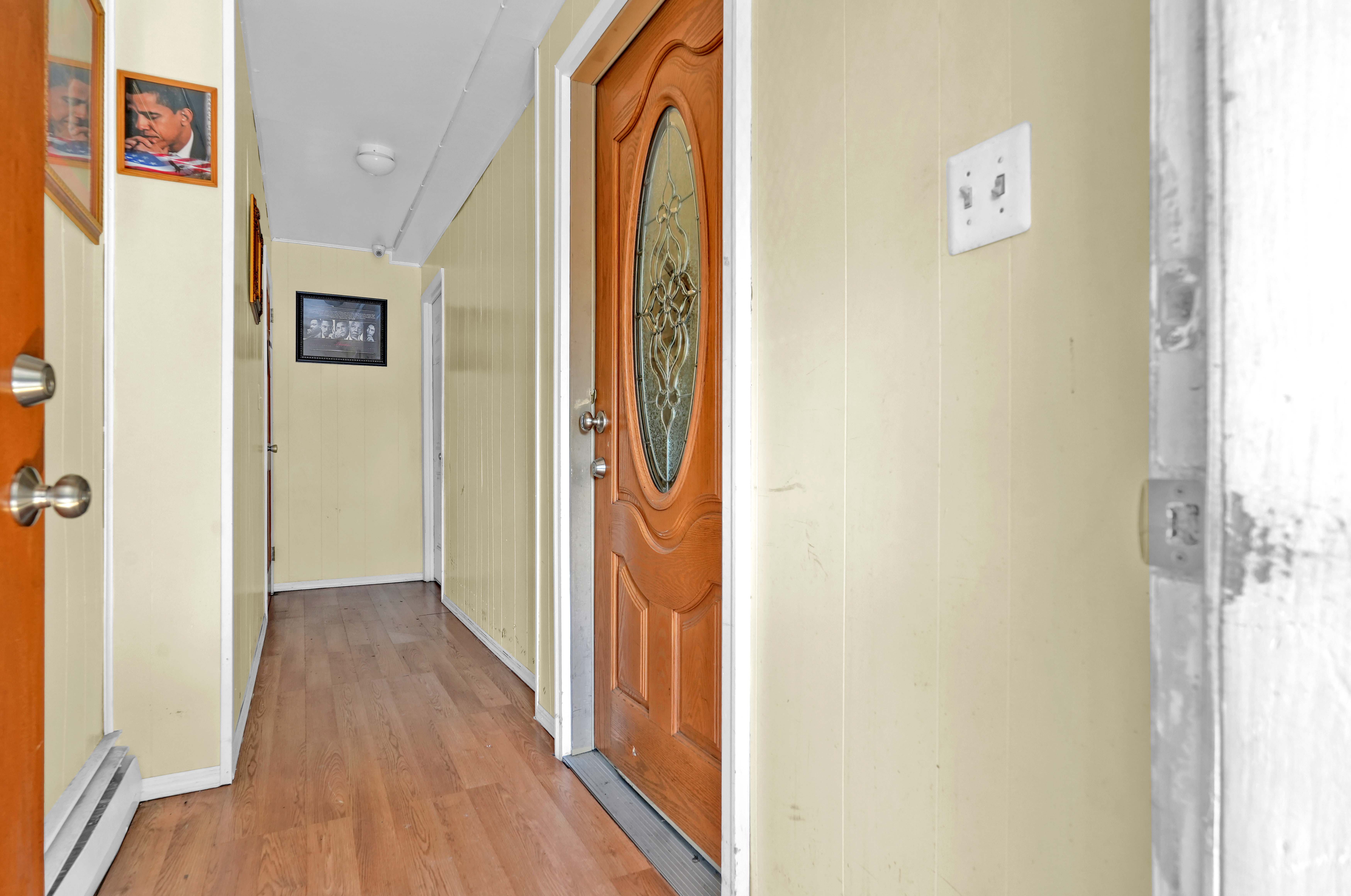 659 Jerome Street Brooklyn, NY 11207 - Photo 5 of 39 a view of a hallway with wooden floor and entryway