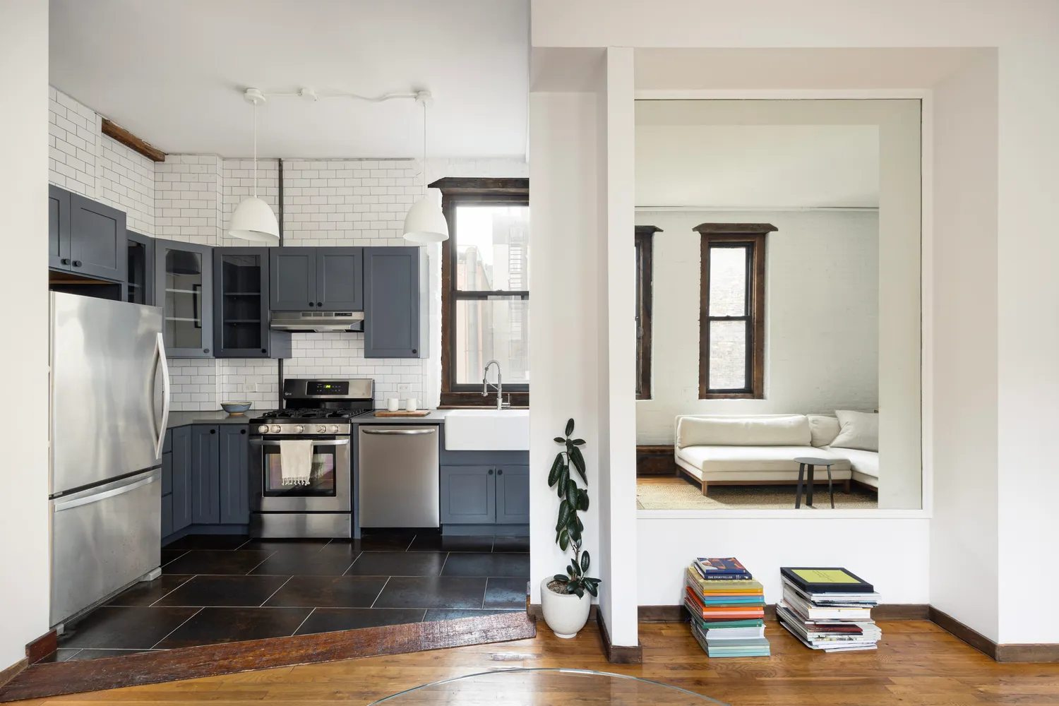 a kitchen with stainless steel appliances kitchen island granite countertop a refrigerator stove microwave and sink