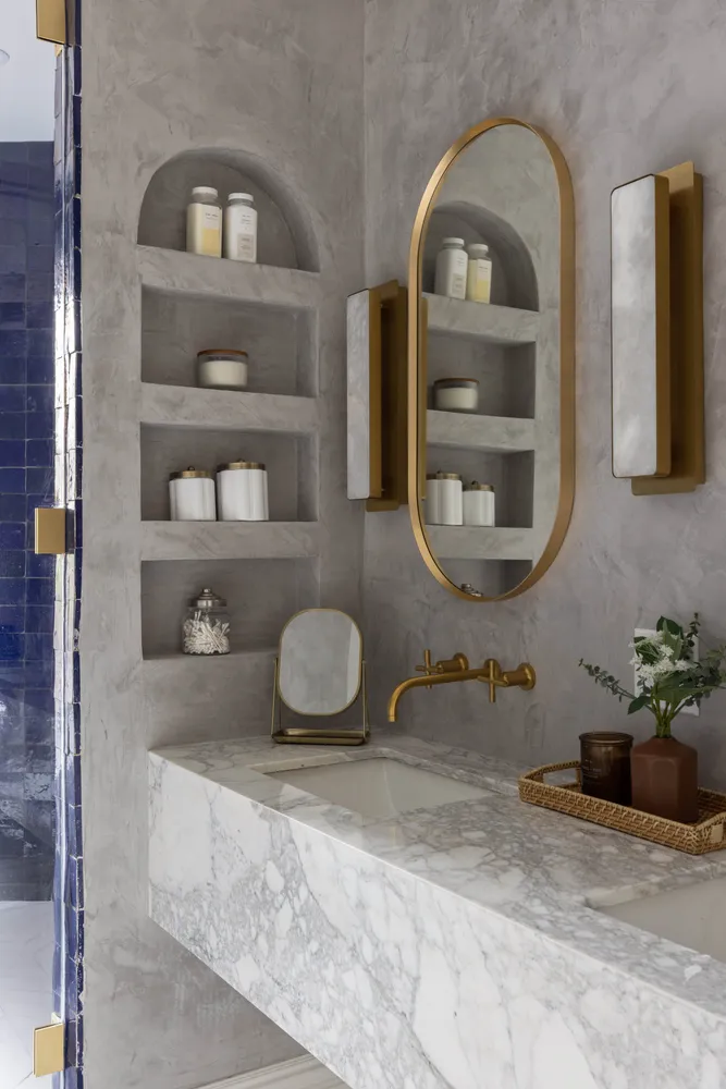 a room with two wooden floor and a mirror