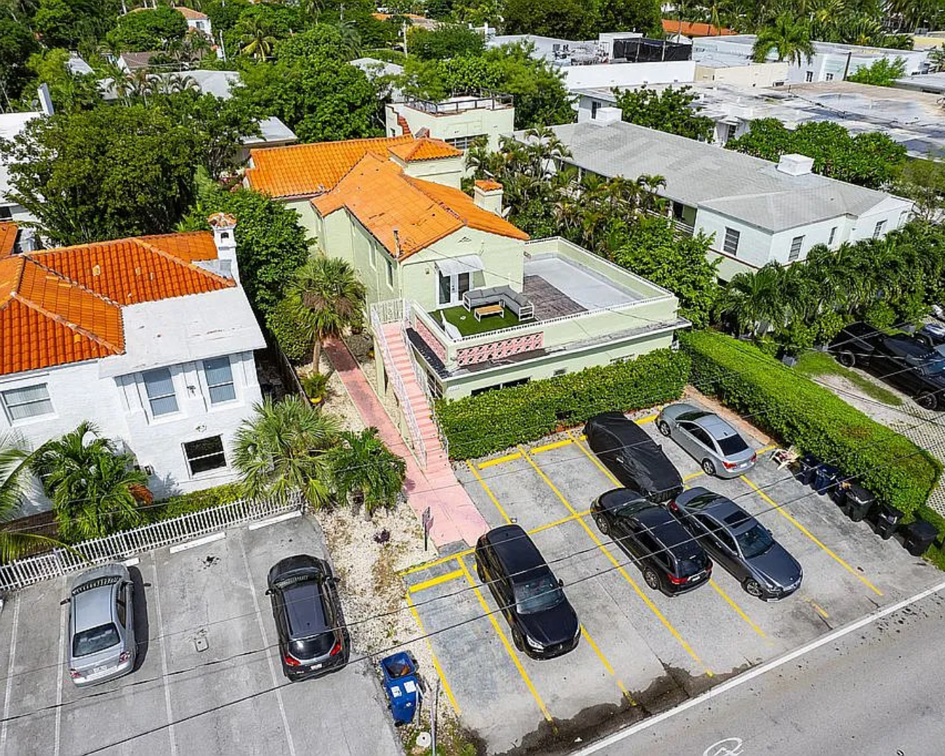 an aerial view of a house with yard