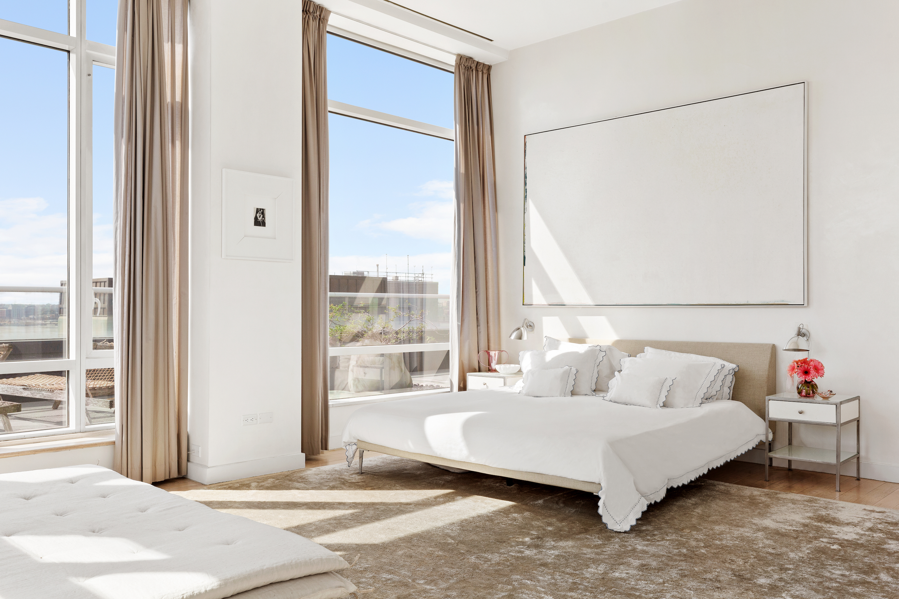 330 Spring Street, Unit PH Manhattan, NY 10013 - Photo 5 of 23 a spacious bedroom with a bed and a window