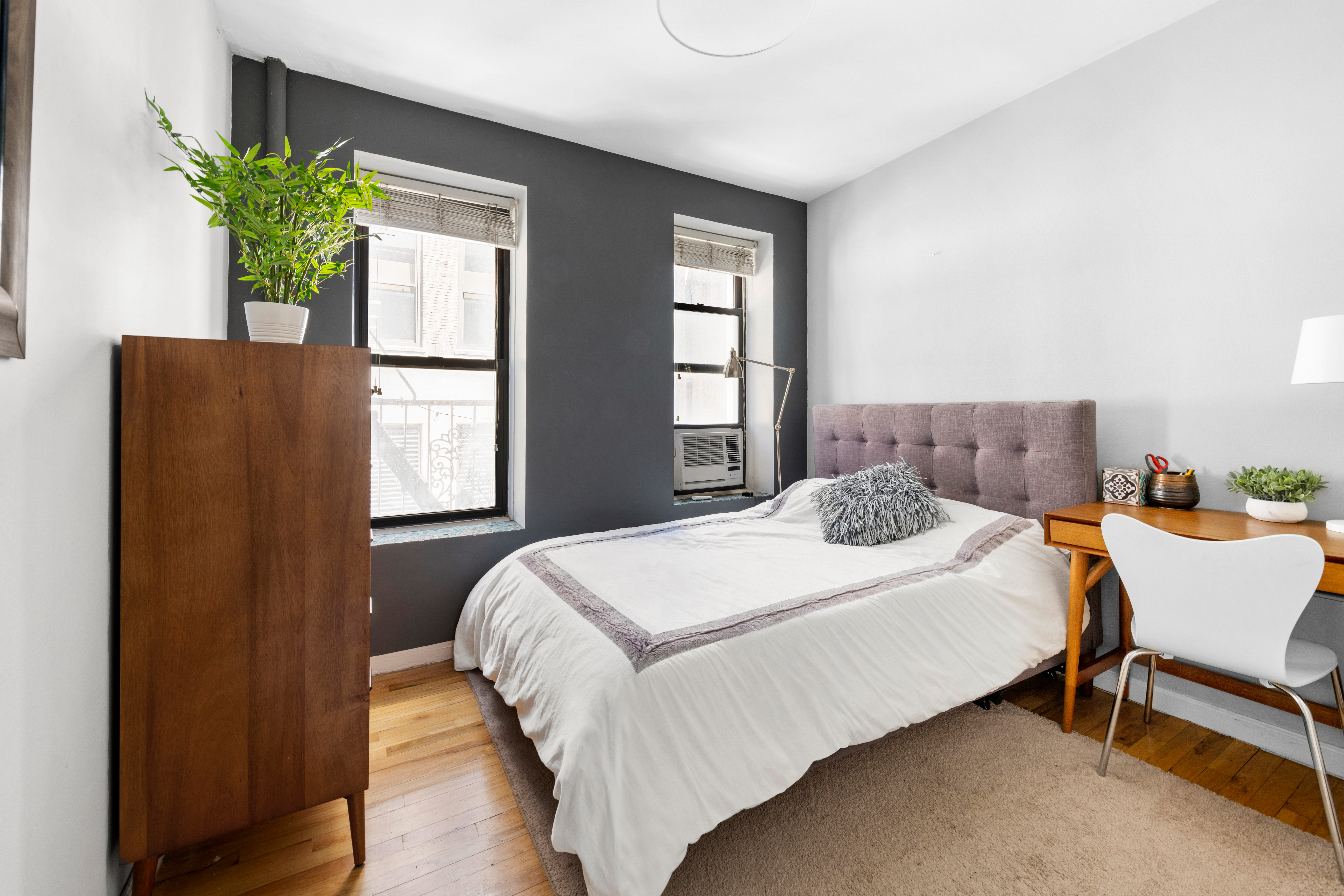 321 East 12th Street, Unit 24 Manhattan, NY 10003 - Photo 5 of 8 a bedroom with a bed and a window