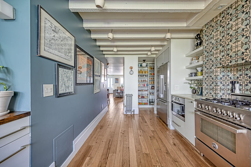 315 15th Street Brooklyn, NY 11215 - Photo 7 of 25 a view of a kitchen with wooden floor and cabinets