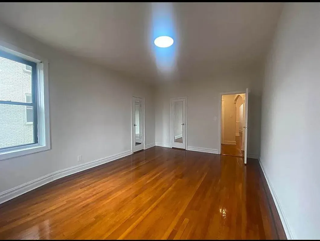 a view of an empty room and window