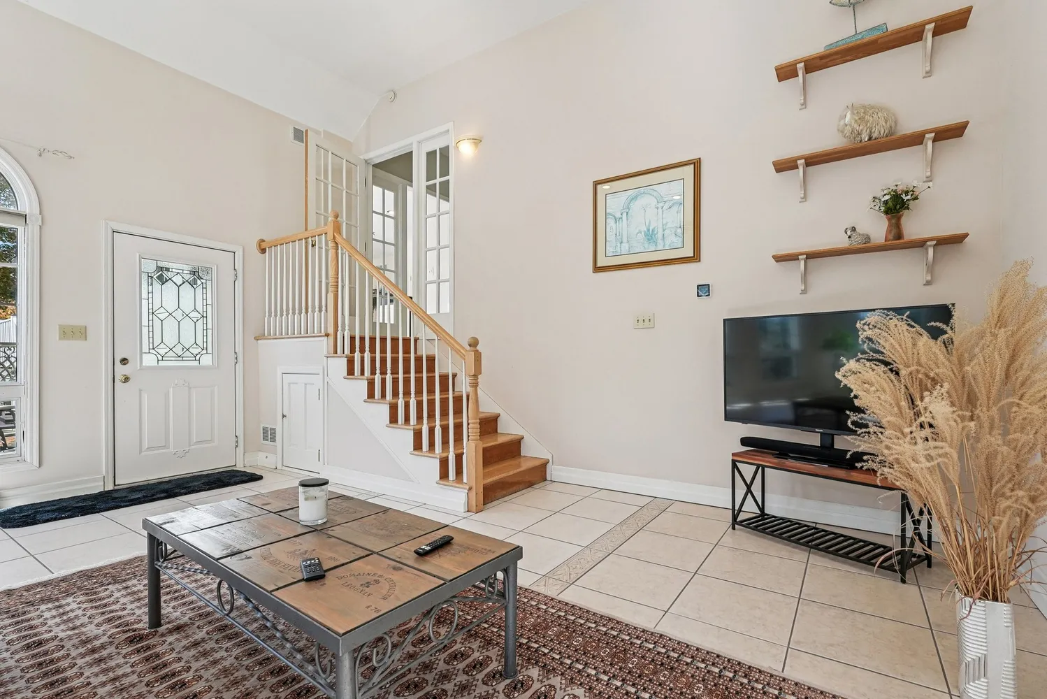 a living room with furniture and a flat screen tv