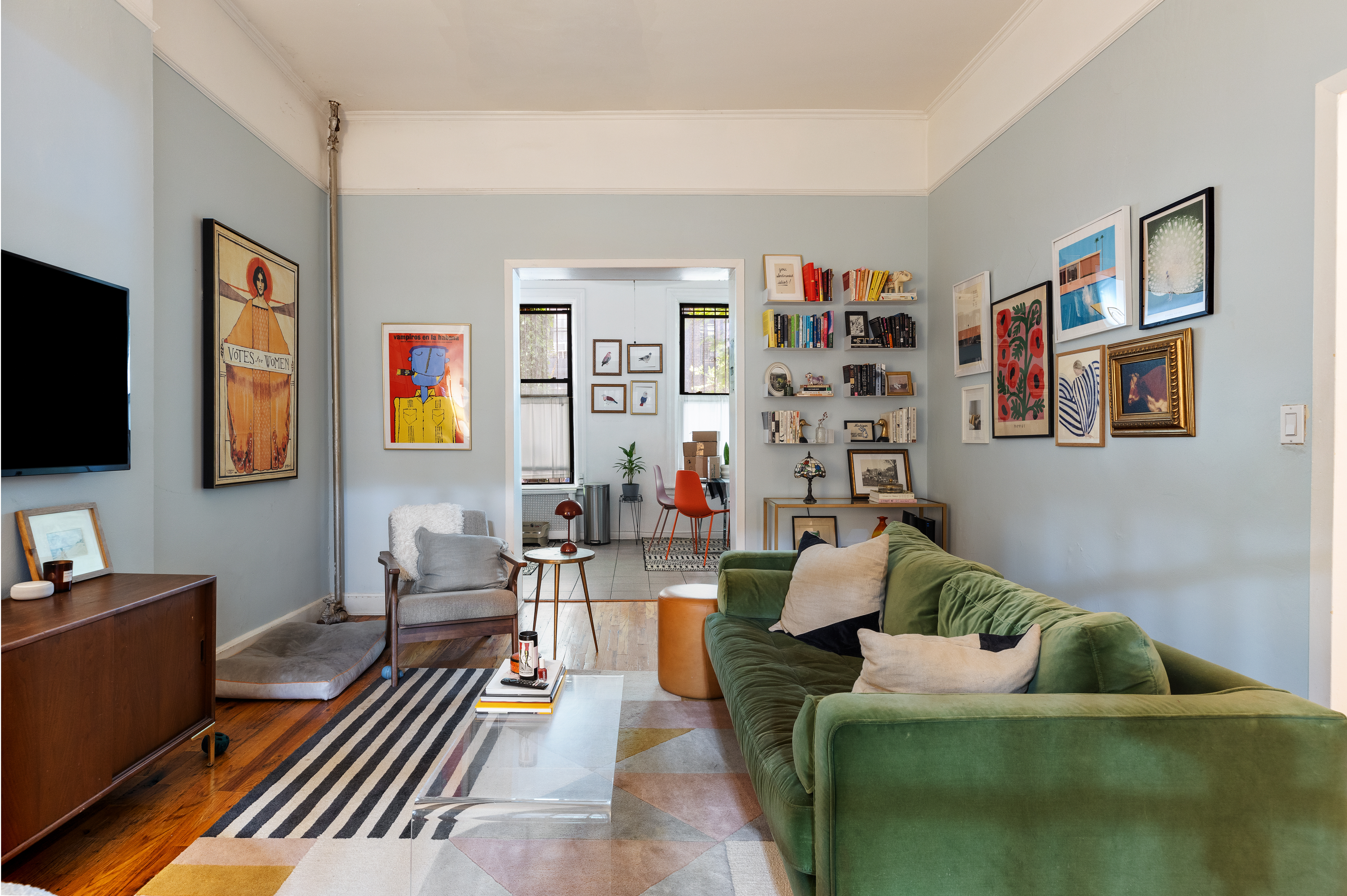 118 St James Place, Unit MULTIFAMILY Brooklyn, NY 11238 - Photo 3 of 5 a living room with furniture and a flat screen tv