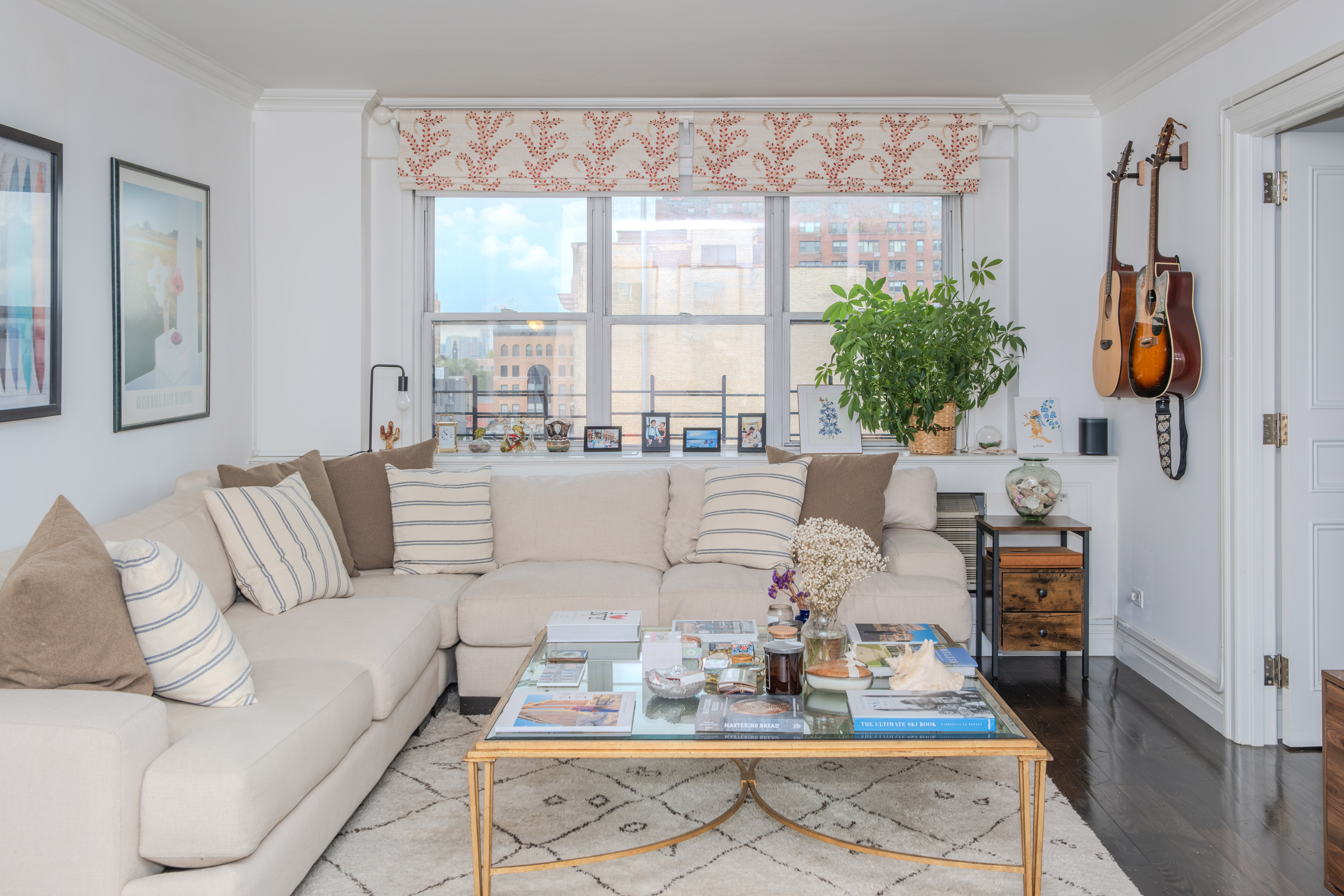 31 Jane Street, Unit 9AB Manhattan, NY 10014 - Photo 6 of 14 a living room with furniture and a large window