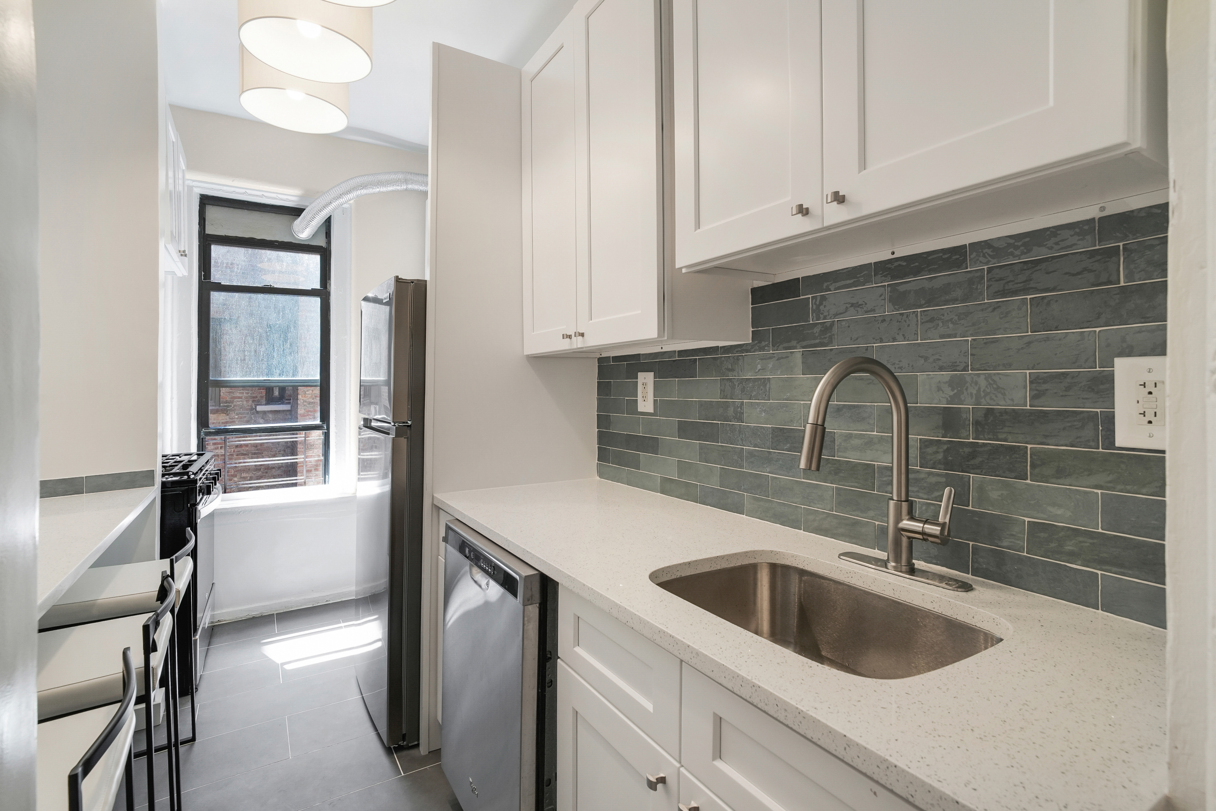200 West 109th Street, Unit C1 Manhattan, NY 10025 - Photo 3 of 16 a kitchen with a sink and cabinets