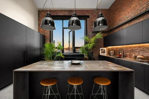 a kitchen with a table and chairs in it