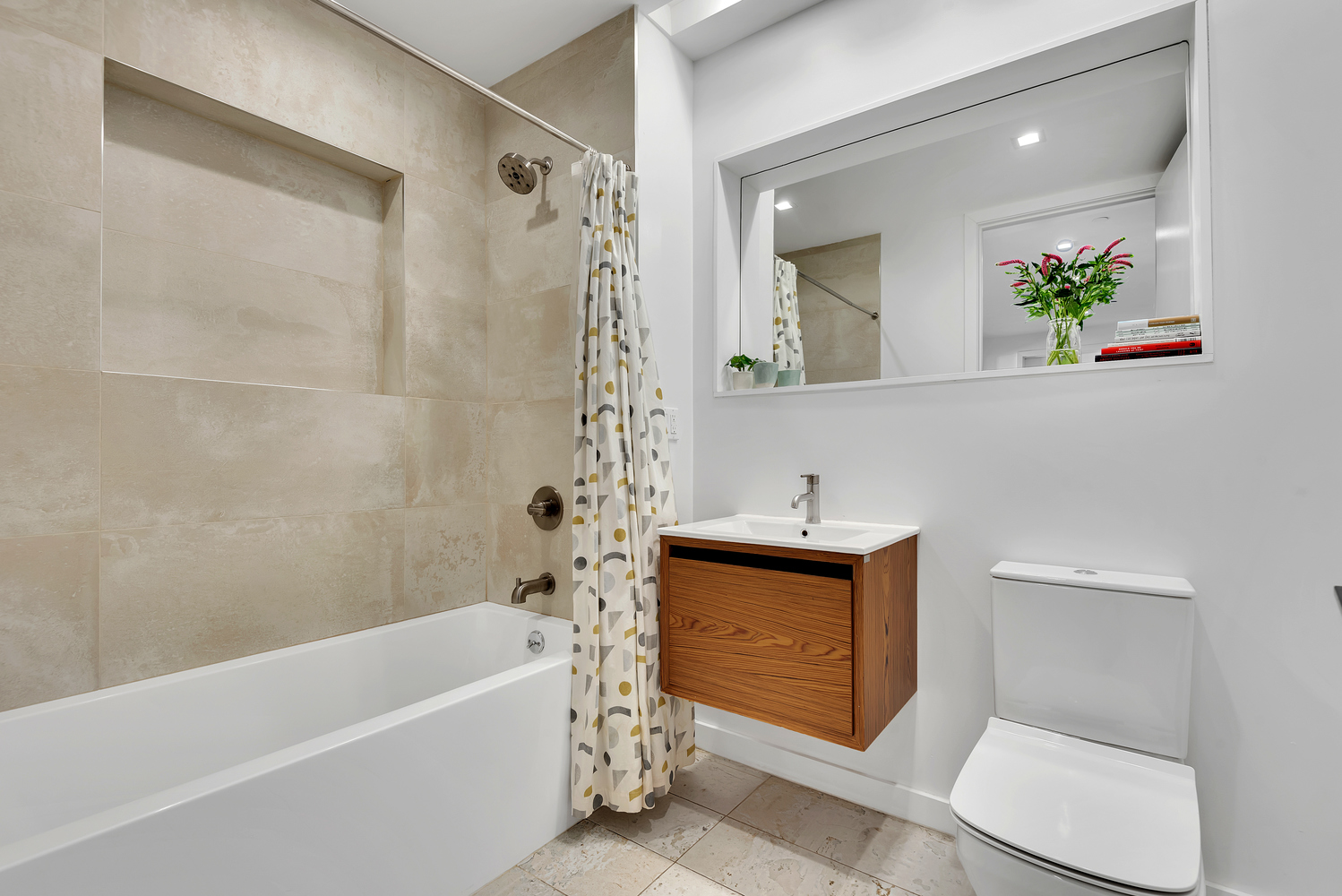 267 Evergreen Avenue, Unit PH Brooklyn, NY 11221 - Photo 14 of 19 a bathroom with a sink a bathtub and a toilet