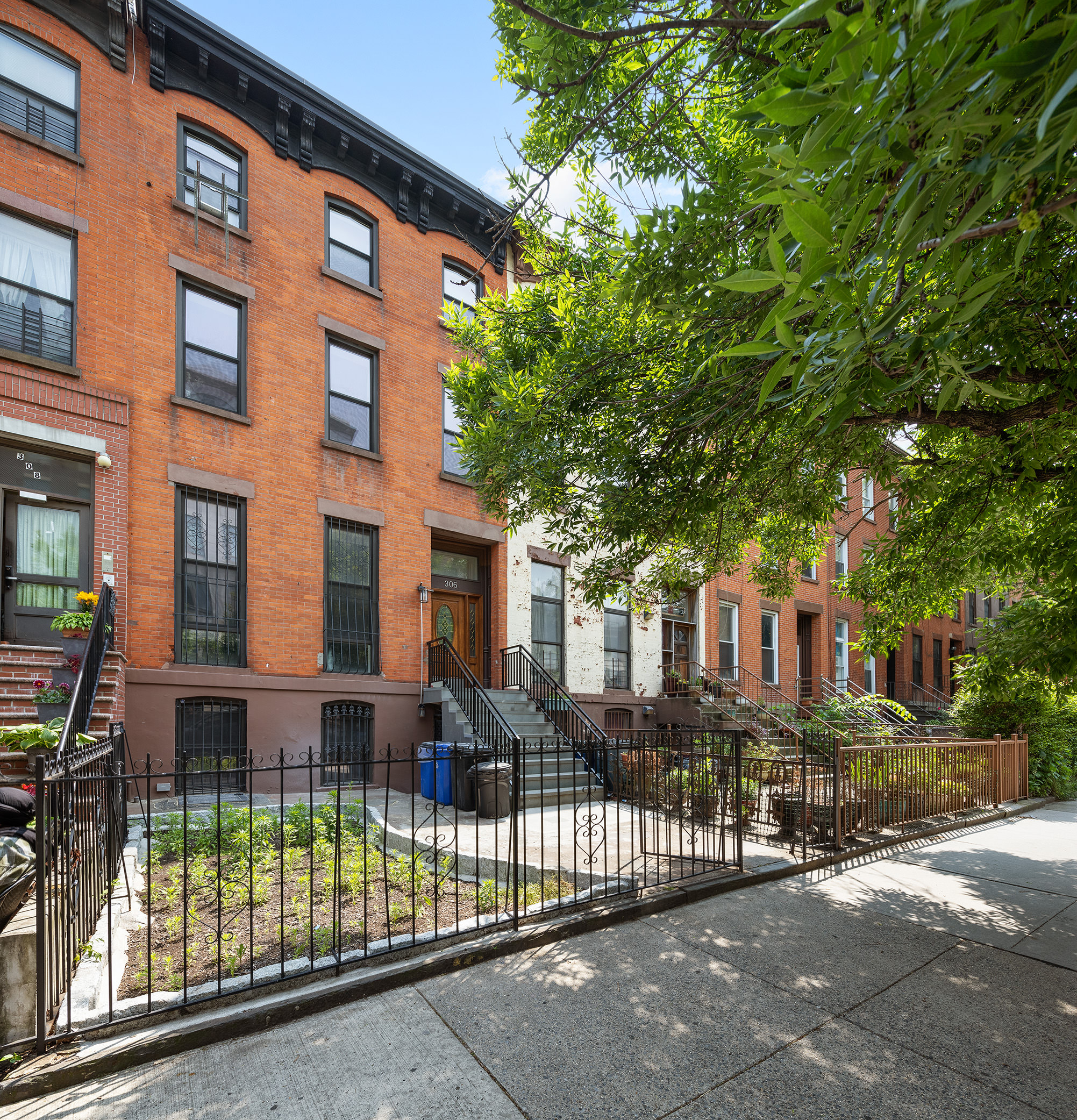 306 Gates Avenue, Unit 1A Brooklyn, NY 11216 - Photo 12 of 14 a view of a brick building next to a road