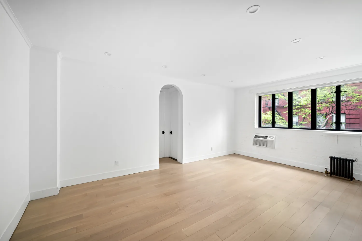 a view of an empty room with windows