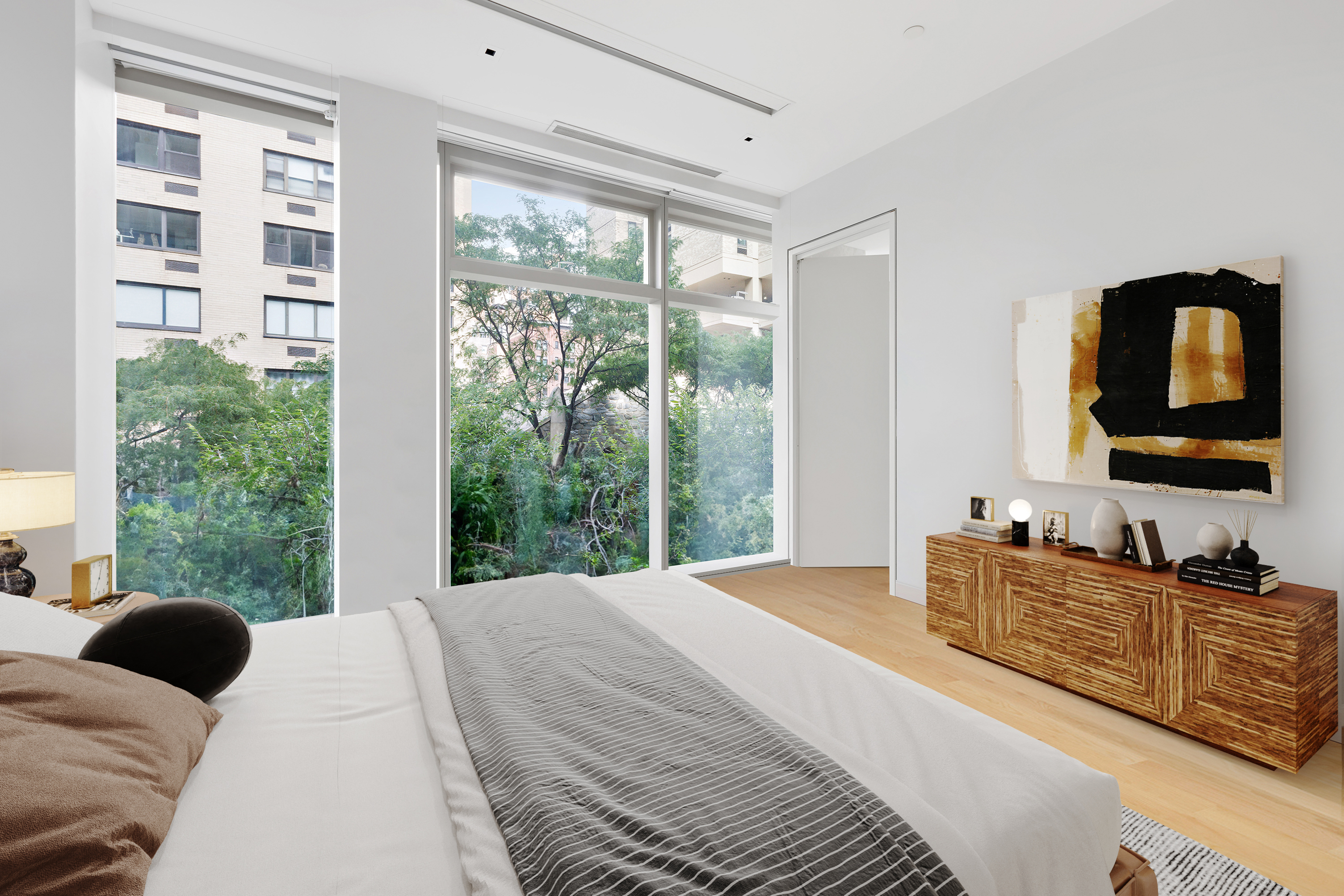 1055 Park Avenue, Unit 1 Manhattan, NY 10028 - Photo 16 of 19 a bedroom with a large bed and a window