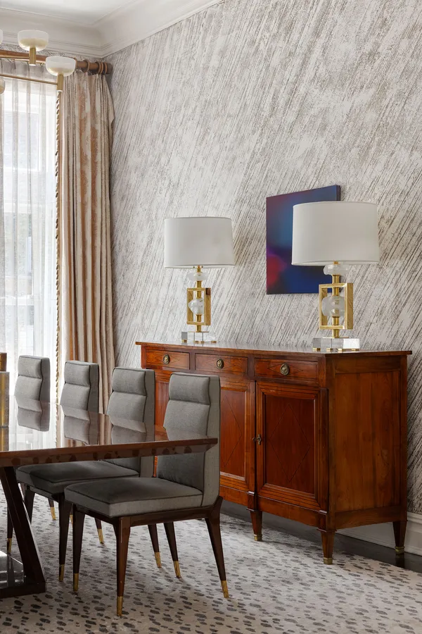 a dining room with furniture and window