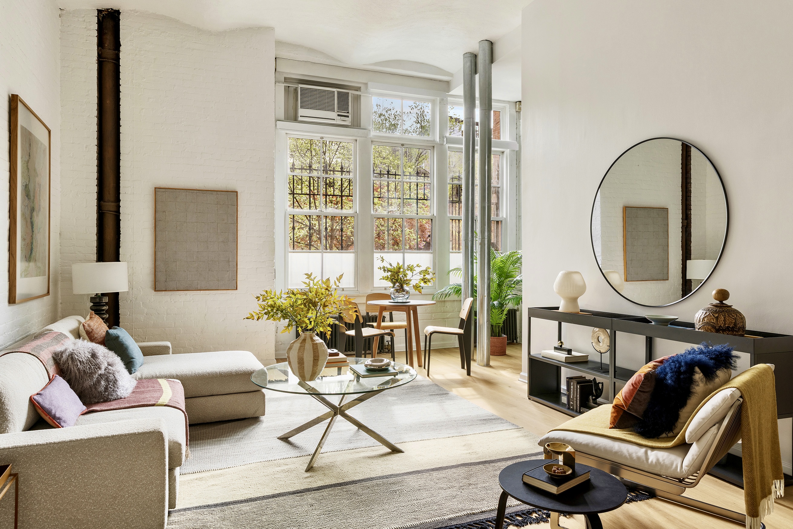 720 Greenwich Street, Unit 1F New York, NY 10014 - Photo 2 of 16 a living room with furniture a fireplace and a potted plant