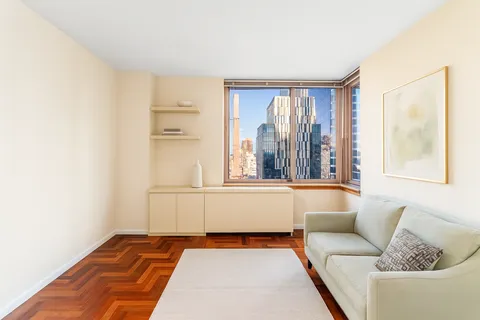 a living room with furniture and a rug